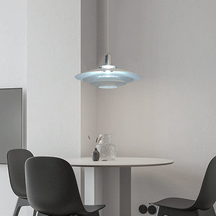 Modern pendant light hanging above a dining table 