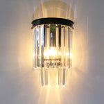A modern wall light fixture with black metal and crystal elements nz
