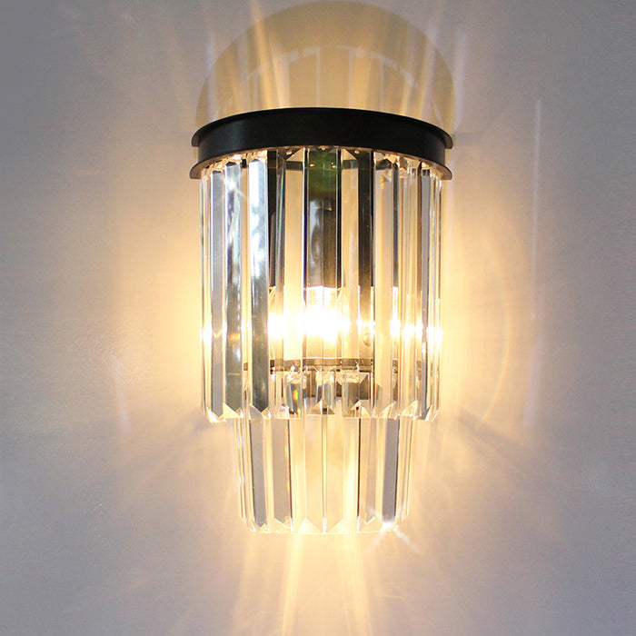 A modern wall light fixture with black metal and crystal elements nz