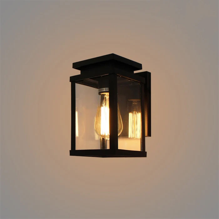 Black outdoor wall light fixture with a clear glass cover nz