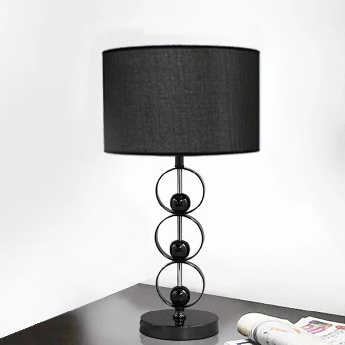 Black table lamp with decorative base on deck nz