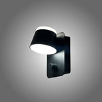 Black wall-mounted light fixture on a gray wall Auckland