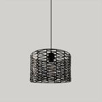 Black woven pendant light above dinning table nz
