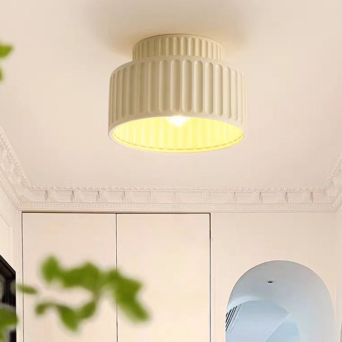 Ceiling light fixture on a white ceiling with decorative molding nz