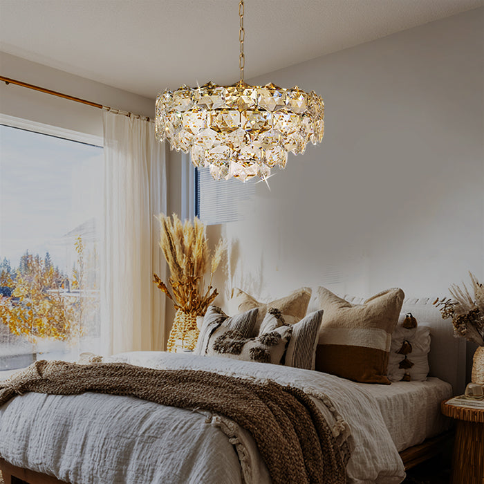 Chandelier hanging above a bed in a bedroom nz homes