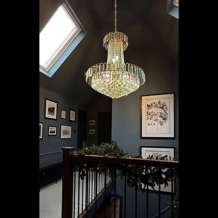 Chandelier hanging in a room with dark walls nz houses