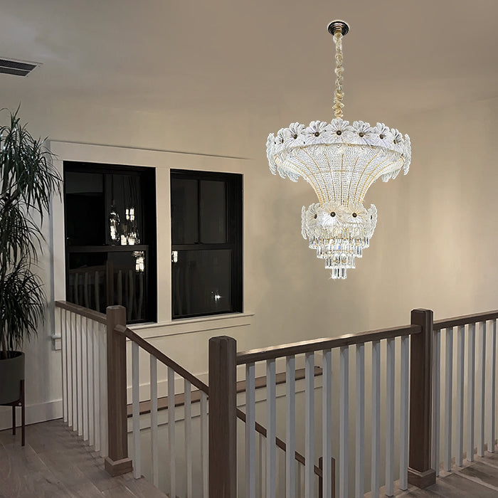 Chandelier hanging above a staircase with a window auckland homes