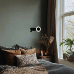 Cozy bedroom with wall lamp near a window nz homes