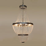 Crystal chandelier hanging against a beige above table nz