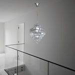 Crystal chandelier hanging in a modern interior setting with a glass railing nz