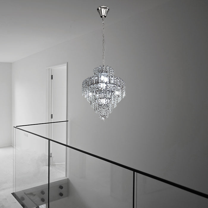 Crystal chandelier hanging in a modern interior setting with a glass railing nz