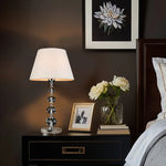Decorative table lamp on a nightstand  in a bedroom NZ