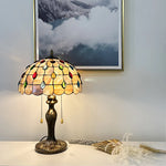 Decorative table lamp with stained glass shade on a surface onthe enrty table nz