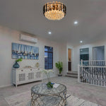 Living room with a smoke clear crystal chandelier west auckland