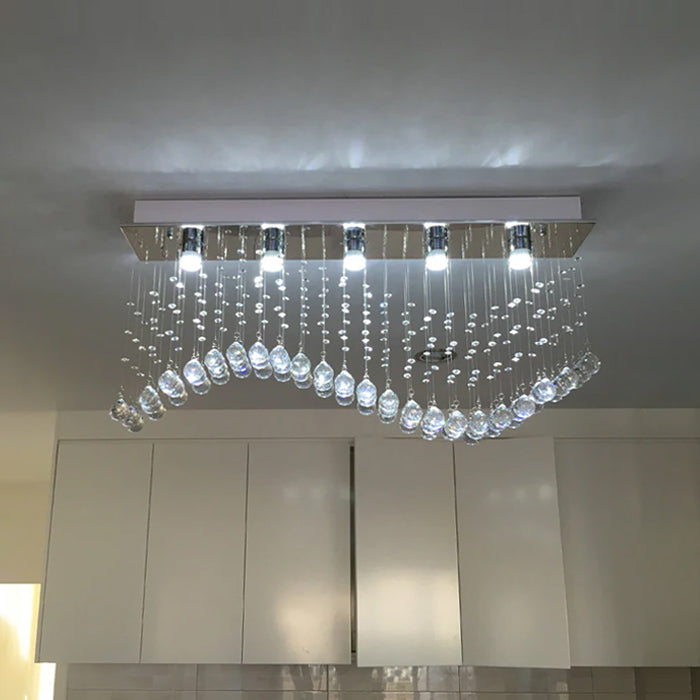 Modern chandelier with crystal accents hanging from a ceiling nz