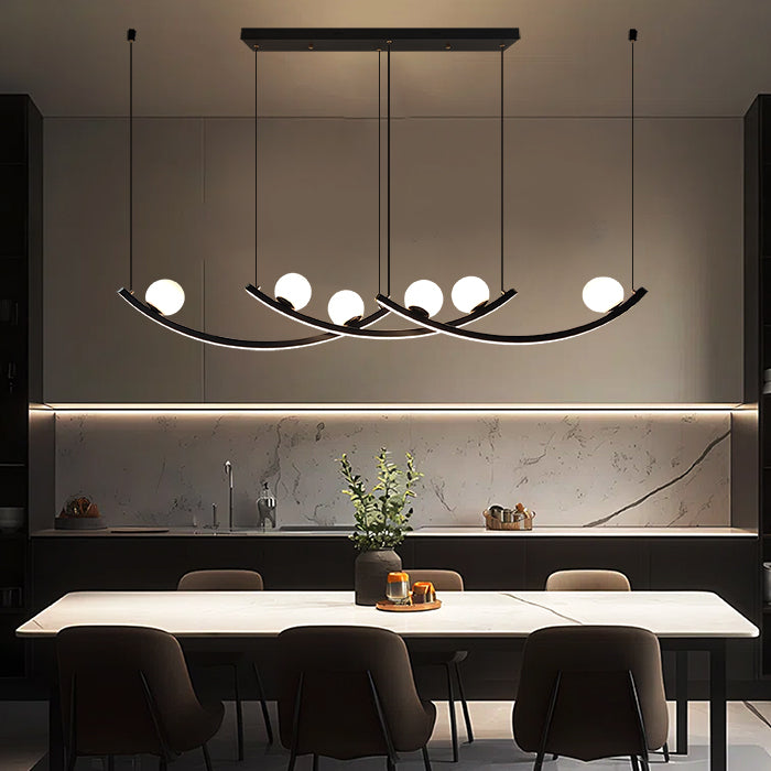 Modern chandelier hanging above a dining table in a kitchen setting nz