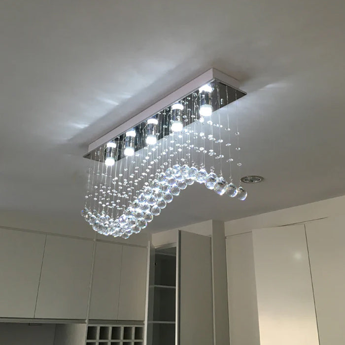 Modern chandelier with LED light bulb on the kitchen ceiling