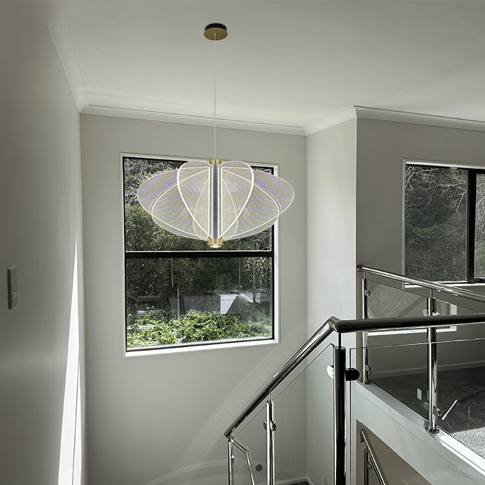 Modern interior with a chandelier hanging above a staircase nz