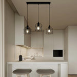 Modern kitchen with pendant lights over a small island auckland
