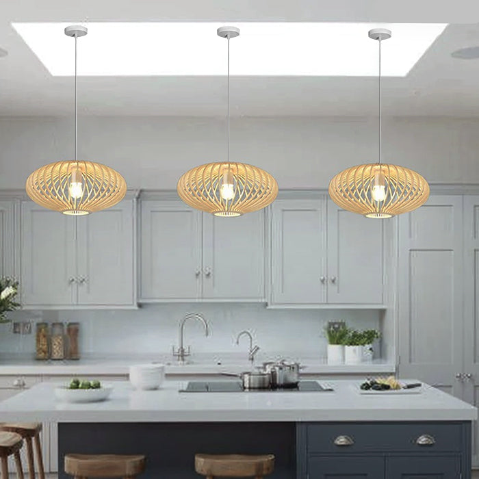 Modern kitchen with pendant lights hanging above a countertop nz
