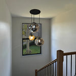 Modern pendant light fixture hanging in a stairwell NZ