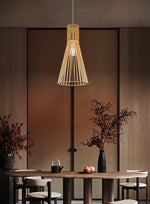 Modern pendant light hanging above a dining table auckland