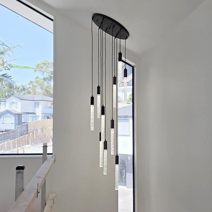 Modern pendant light fixture in a room with large windows nz homes