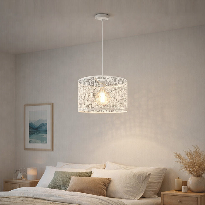 Modern pendant light hanging above a bed in a bedroom nz