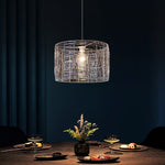 Modern pendant light hanging above a dining table auckland homes