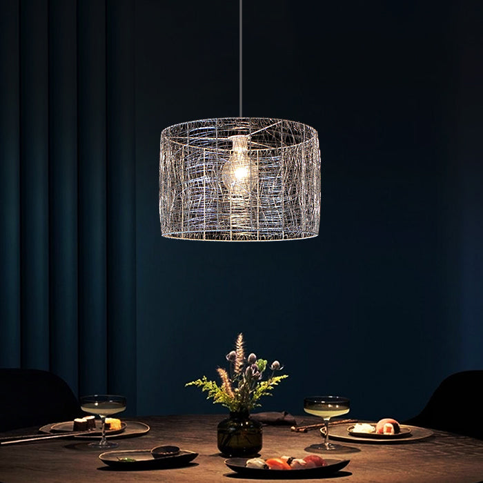 Modern pendant light hanging above a dining table auckland homes