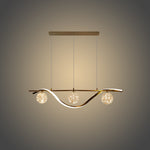 Modern pendant light with three spherical bulbs above kitchen island nz