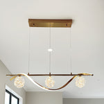Modern pendant light fixture with three spherical glass shades  above kitchen island nz