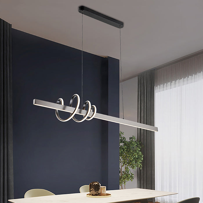 Modern pendant light fixture hanging above a dining table auckland