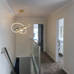 Modern staircase with a stylish light fixture in a home interior auckland