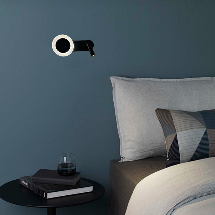 Modern wall light fixture above a bed with a side table auckland