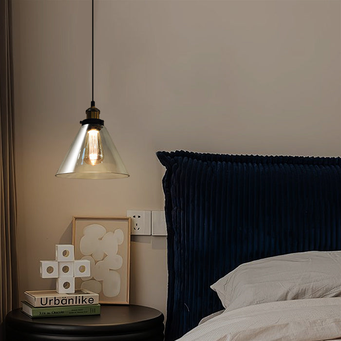 Navy blue upholstered headboard with a lit pendant light nz homes