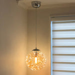 Pendant light with decorative glass shade in a bedroom west auckland