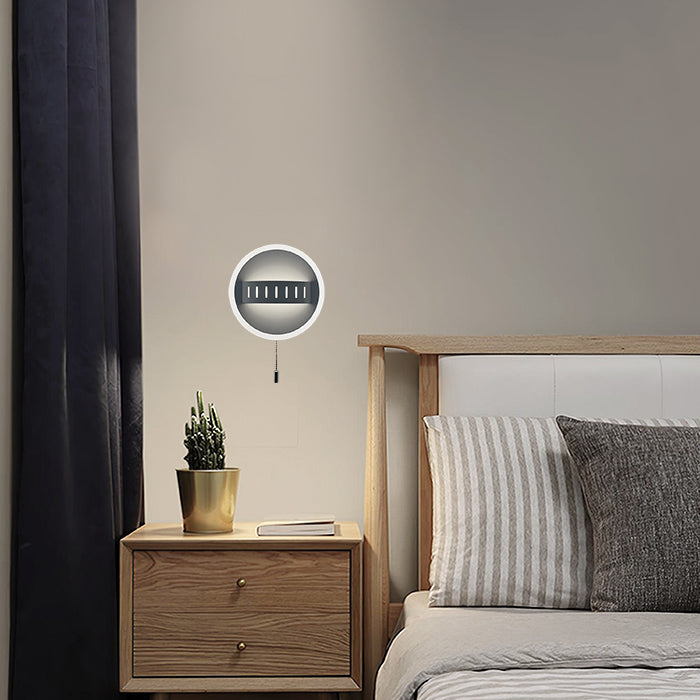 Round wall light fixture on a neutral-colored wall NZ