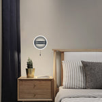 Round wall light fixture on a neutral-colored wall NZ