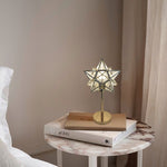Star-shaped table lamp on a marble table west auckland