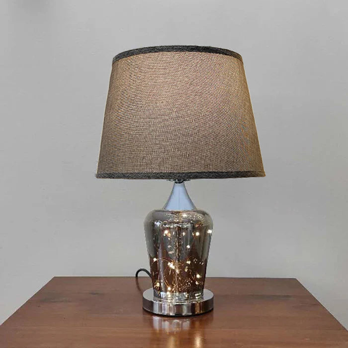 Table lamp with a textured brown shade on the table nz
