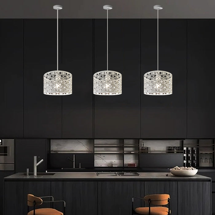 Three modern pendant lights hanging above a kitchen west auckland
