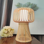 Wooden table lamp with a warm glow on a surface west auckland