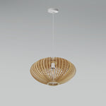 Woven rattan pendant light hanging above table nz