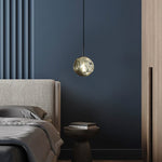 Modern bedroom with small glass pendant light