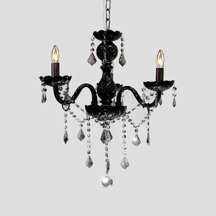 A black chandelier with a glass base and smoke crystals nz