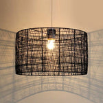 A black iron string pendant light shade hanging from a ceiling chain nz