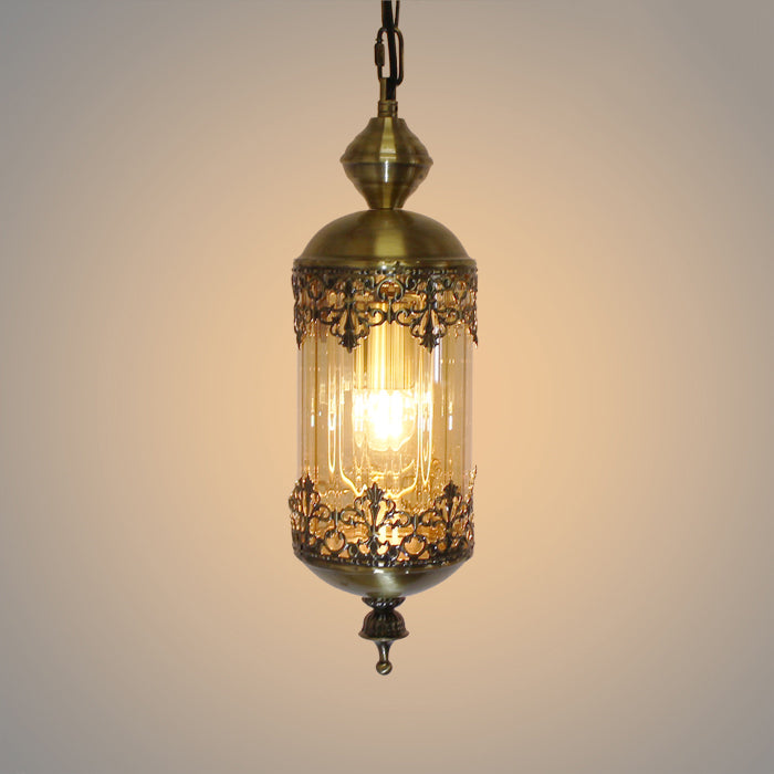A pendant light with a brass metal shade and amber glass nz