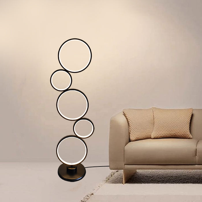 Modern floor lamp with circular design  a living room NZ
