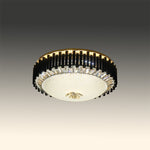 Ceiling light fixture with decorative black and gold rim on a gradient background nz